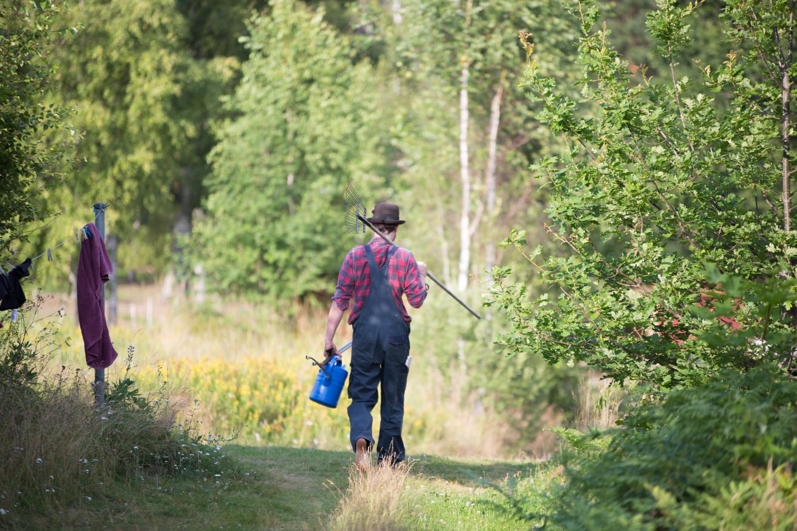 Gardener holding tools while walking