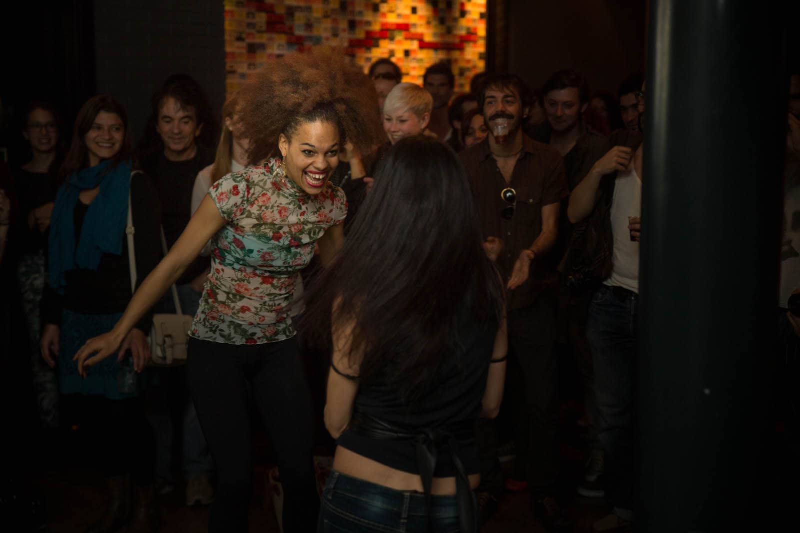 Singer Gigi Mcfarlane dancing with a fan at her concert