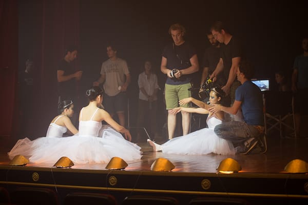 Ballerinas taking a break during the filmmaking process